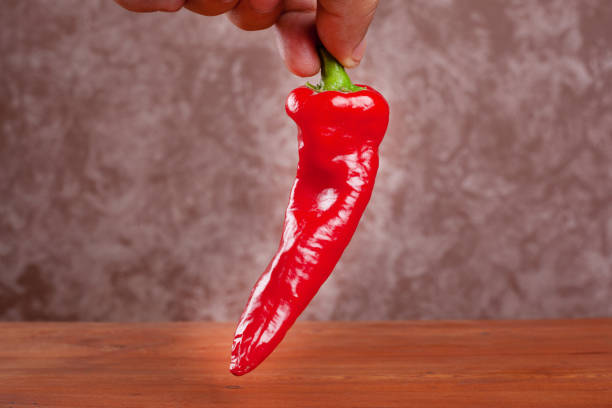 istock fresh homemade red hot chili pepper in hand 1171007772