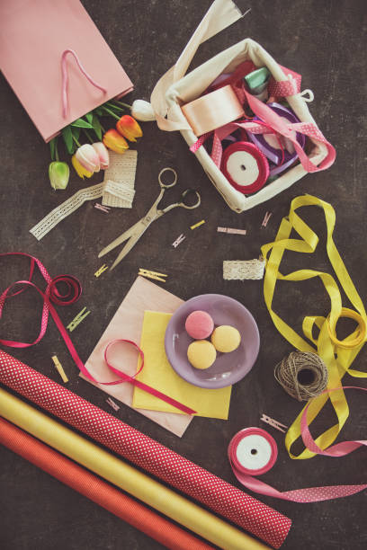 istock Flowers, dessert, and craft equipment on the table 1171009694