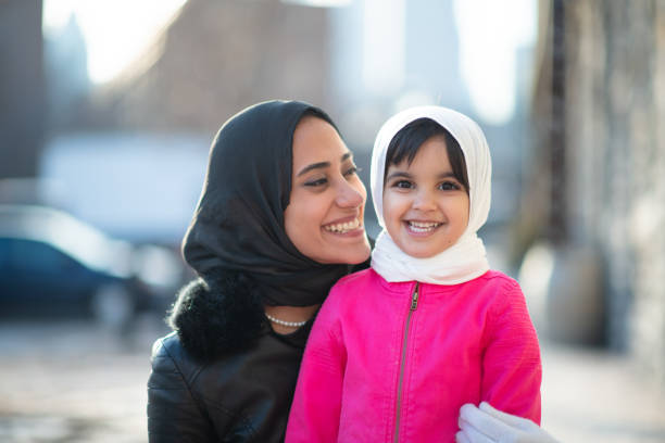 istock Smiling Muslim mother and child 1171009743