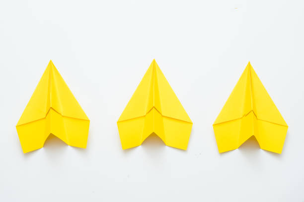 istock team spirit ambition three yellow paper airplanes 1171010020