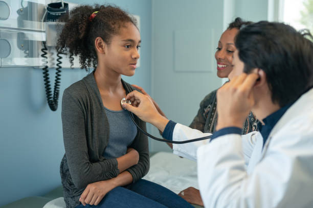 istock Elementary age girl in routine medical appointment 1171010336
