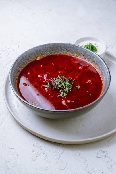 istock Borscht with sour cream on white concrete table 1171012031