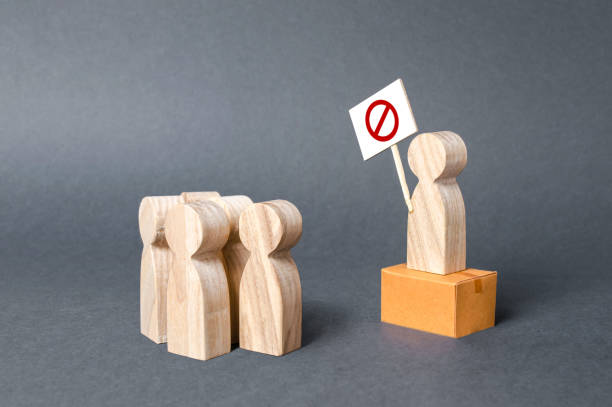 istock A man with a poster agitates people. Call for protests. Drawing public attention to the problem. fight against corruption and arbitrariness. Populism and nationalism. struggle for rights 1171016231
