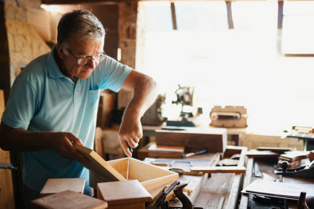 istock Senior man working in a carpentry. 1171017087