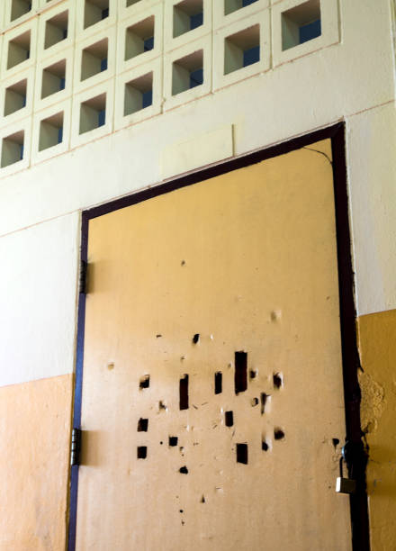 istock Broken holes on the old classroom door are locked 1171019390