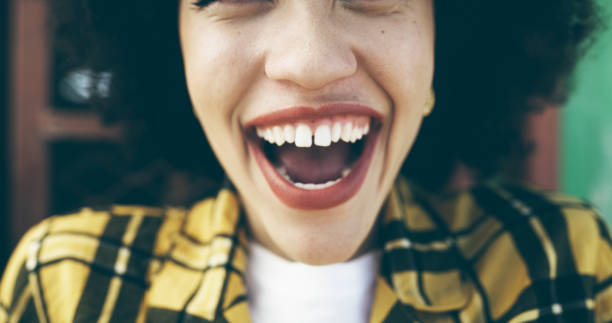 Cropped shot of an attractive young woman expressing happiness in an urban setting