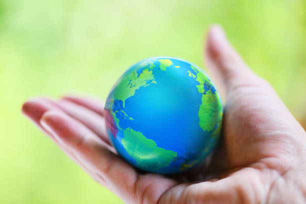 istock The world in the hand with nature background / hand holding globe with map and environment green planet save the earth 1171021613