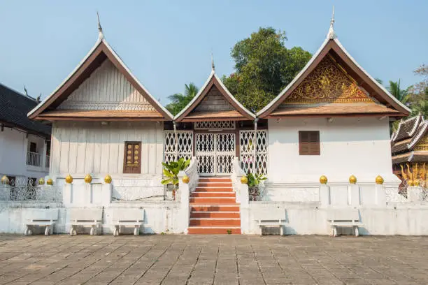 Photo of Buddhist monk’s dwelling in Wat Xieng Thong an iconic temple in Luang Prabang, the UNESCO world heritage town in north central of Laos.