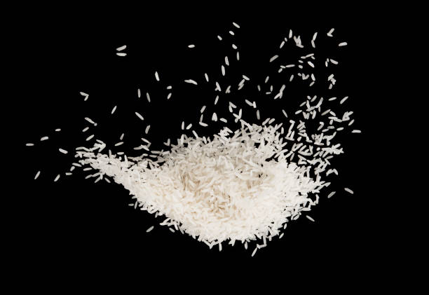 istock Stop motion white rice splash or explodsion flying in the air  isolated on black background food object design 1171027280