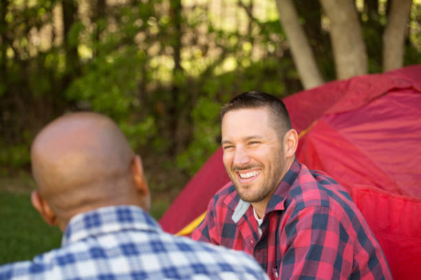 istock Multi-Ethnic group of friends talking and camping 1171028158