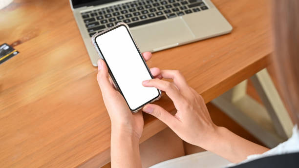 istock Young woman touchscreen on her smartphone mockup with empty screen. 1171029993