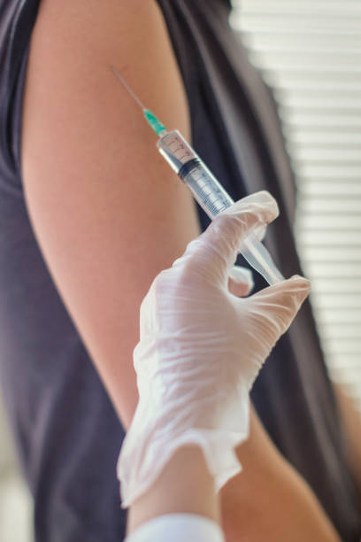 istock Injection, the doctor vaccinates the patient 1171032963