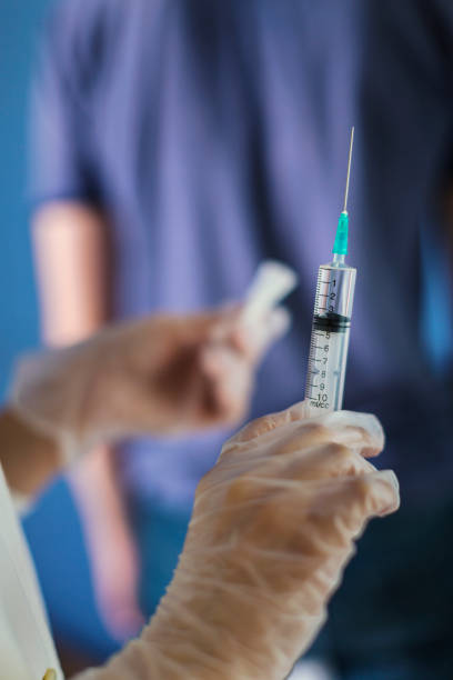 istock Injection, the doctor vaccinates the patient 1171032967
