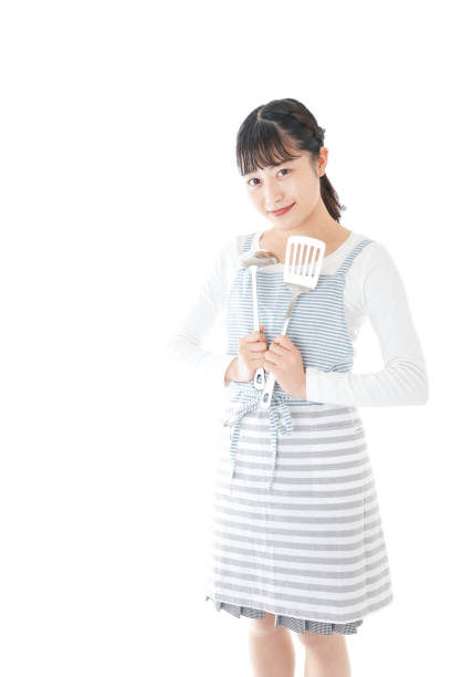 istock Young woman cooking something with smile 1171036086