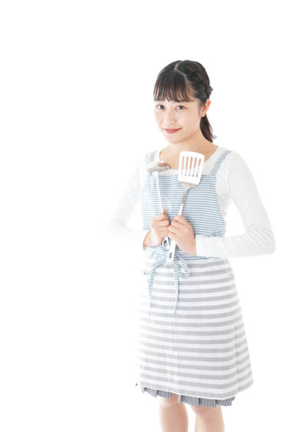 istock Young woman cooking something with smile 1171036105
