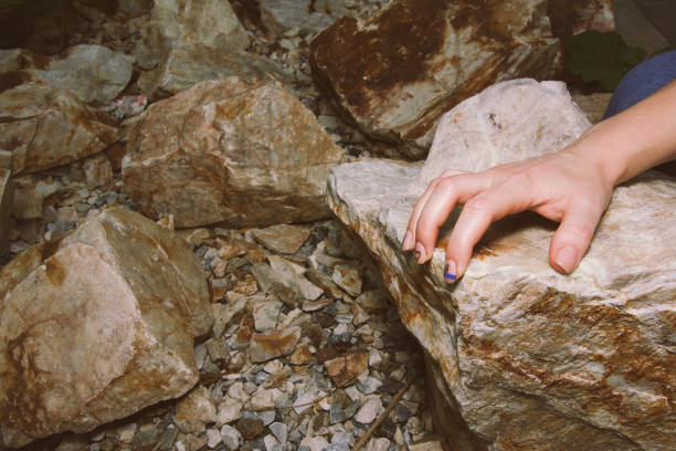 istock Woman's hand on a warm evening summer stone 1171039959