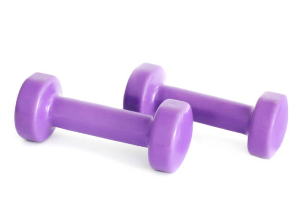 istock Small dumbbells on a white background. Purple Dumbbells 1171050282