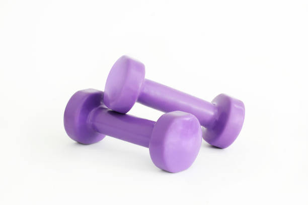 istock Small dumbbells on a white background. Purple Dumbbells 1171050942