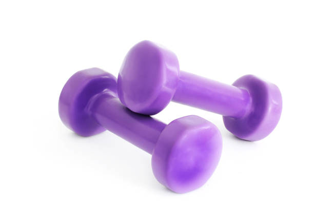 istock Small dumbbells on a white background. Purple Dumbbells 1171050961