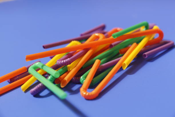 istock A lot of plastic tubules for drinks. Blue background. 1171059391