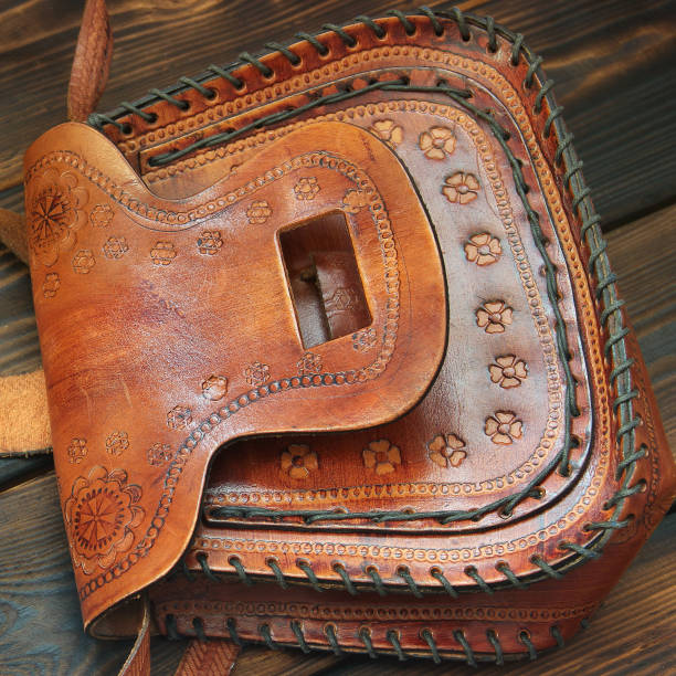 istock Leather bag on wooden background 1171060500