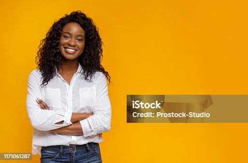 istock Confident smiling african american girl with crossed hands on chest 1171061287