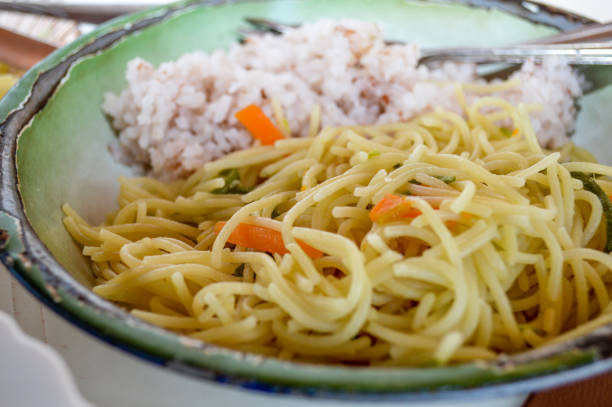 Vietnamese vegetarian mi xao with white rice.