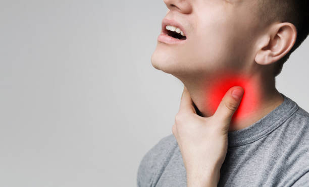 Man with thyroid gland problem, touching his neck Man with thyroid gland problem, touching his neck, closeup, panorama, empty space lymphoma photos stock pictures, royalty-free photos & images