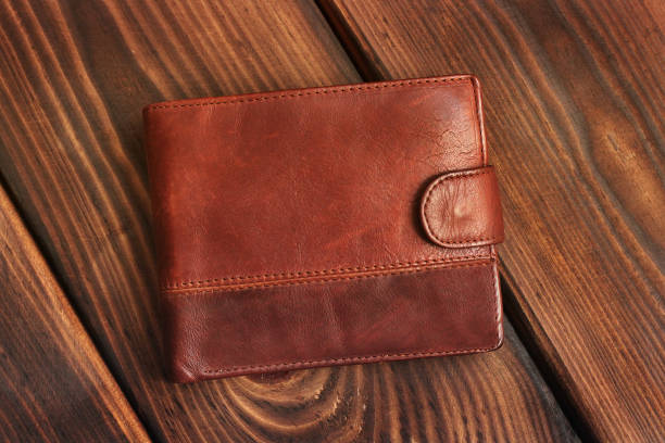 istock Leather wallet on a wooden background. 1171061732