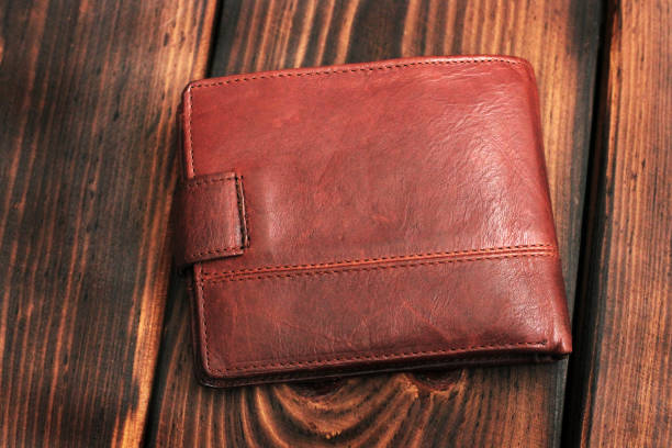 istock Leather wallet on a wooden background. 1171061846
