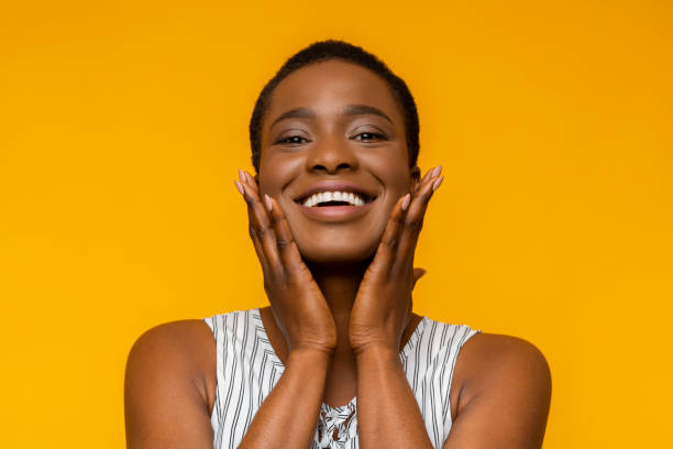 istock Emotional young black woman touching her cheeks 1171062759