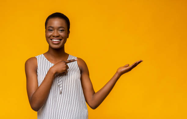 istock Cute black girl pointing at empty space 1171063211