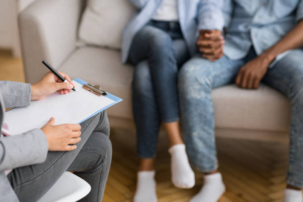 istock Unrecognizable Afro Husband And Wife Holding Hands During Marital Therapy 1171063264