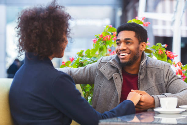 istock Handsome black guy looking at his woman with smile 1171063291