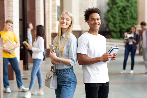 istock College students posing to camera in university campus 1171063944