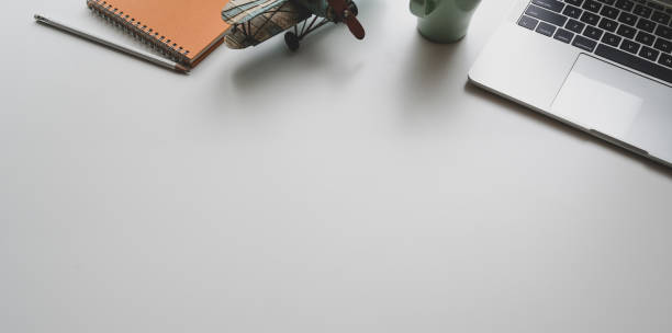 istock Modern workplace with laptop and office supplies on white desk background 1171064321