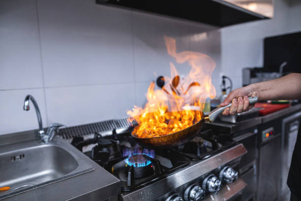 istock Skilled chef preparing an exclusive flaming meal at a restaurant 1171065785