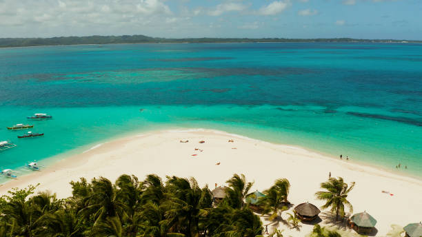 istock Tropical Daco Island with a sandy beach and tourists 1171066161