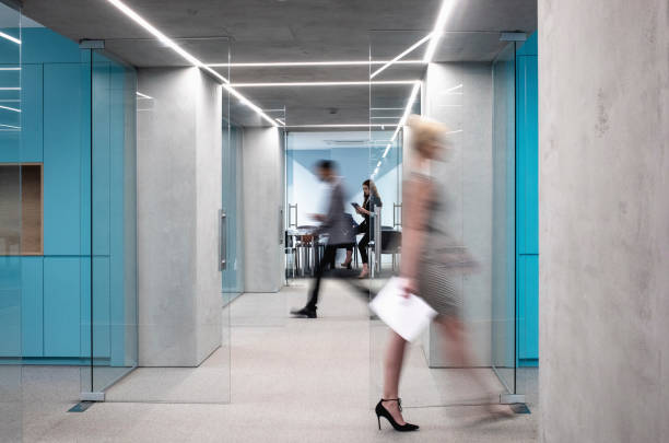 istock Business People Walking Down The Hallway 1171072329