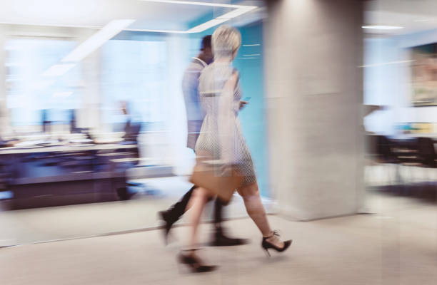 istock Business People Walking Down The Hallway 1171072889