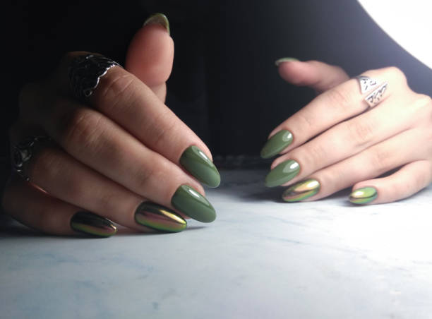 istock Green gel polish with iridescent cat eye 1171079637