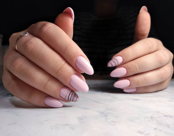 istock soft pink manicure with a geometric design 1171079666