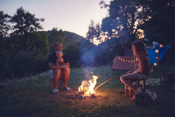 istock Father with children making a camping fire in the backyard. 1171079806