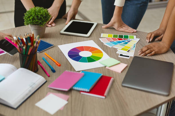 istock Group of graphic designers checking on color swatch samples 1171081979