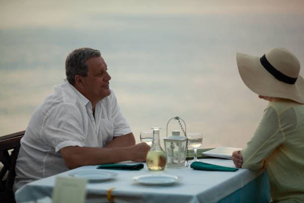 istock Romantic evening for mature couple in the seafront restaurant 1171083908