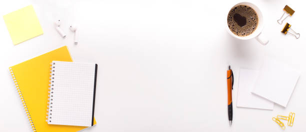 istock Morning coffee on workplace with yellow stationery and notepad 1171084333