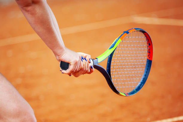 istock Tennis player hitting two-handed backhand. 1171084369