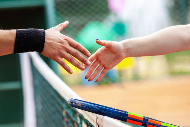 istock Tennis players shake hands after match closeup. 1171084397