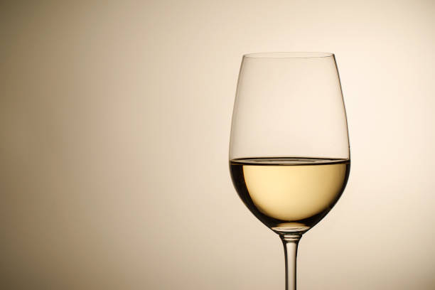 wineglass with white wine and copy space - wine glass white wine wineglass imagens e fotografias de stock