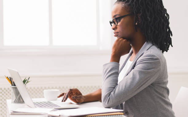 istock Serious Black Business Girl Using Laptop At Workplace 1171086951